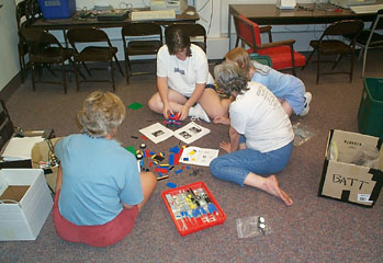 Judy & Meeka helping Elanor & Pat with their robot while the guys fix our chip problem